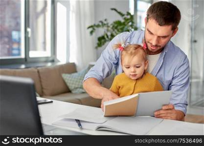 multi-tasking, freelance and fatherhood concept - working father with baby daughter and notebook at home office. working father with baby daughter at home office