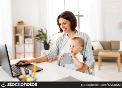 multi-tasking, freelance and motherhood concept - working mother baby boy and laptop computer at home office. working mother with baby boy and laptop at home