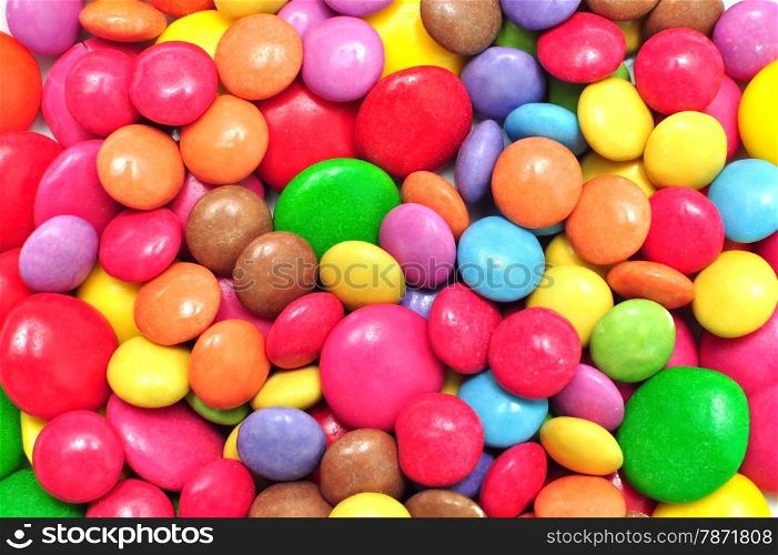 Multicolor round coated candies background sweet pattern