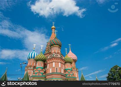 Multicolor towers of St. Basil?s Cathedral against a cloudy sky, Moscow, Russia.