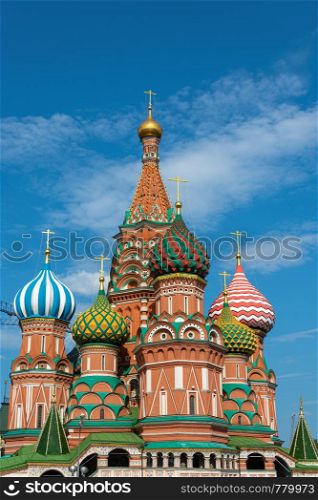 Multicolor towers of St. Basil?s Cathedral against a cloudy sky, Moscow, Russia.