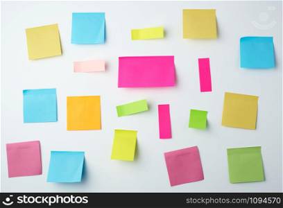 multicolored blank paper stickers of different sizes and shapes on a white background