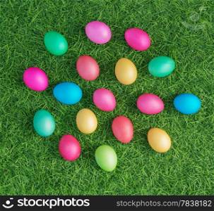multicolored easter eggs on the green grass