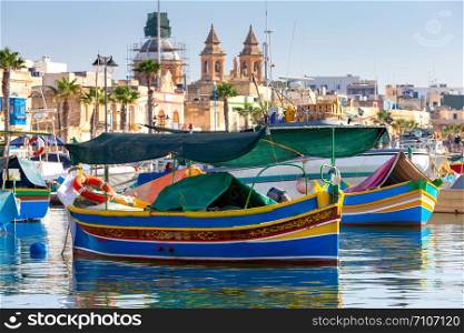 Multicolored fishing boats Luzzu with eyes in the harbor. Marsaxlokk. Malta.. Marsaxlokk. Traditional boats Luzzu in the old harbor.