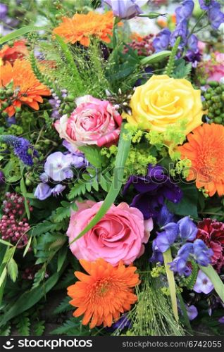 Multicolored floral arrangement with different sorts of flowers in bright colors