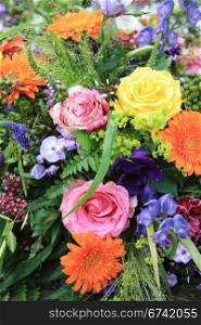 Multicolored floral arrangement with different sorts of flowers in bright colors