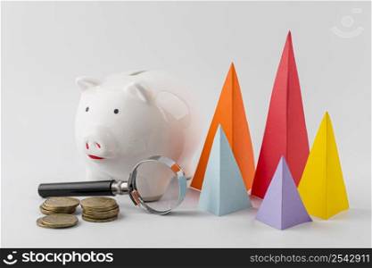 multicolored growth cones with coins piggy bank