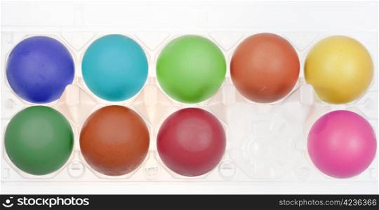 multicolored hen&rsquo;s eggs in holder