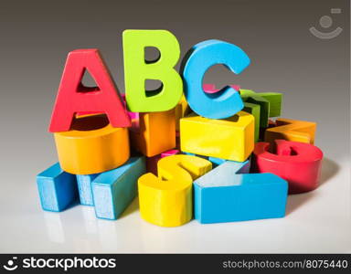 Multicolored letters A B C made of wood.