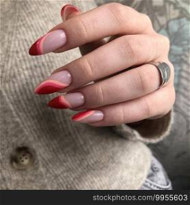 Multicolored manicure close up. Young woman hands with pastel manicure.Bright multi-colored design of manicure. Bright multi-colored design of manicure.Multicolored manicure close up