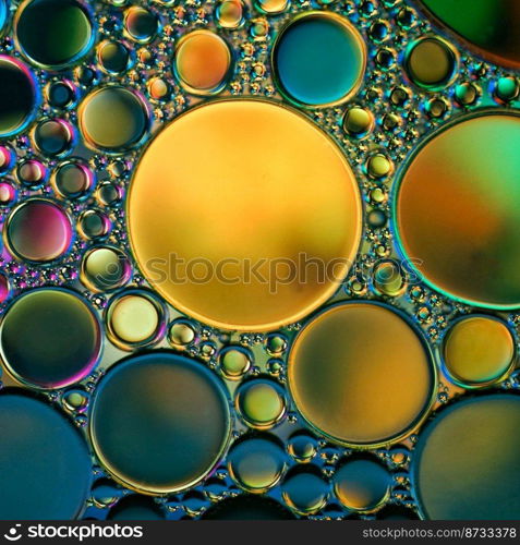 multicolored oil circles on the water, abstract background