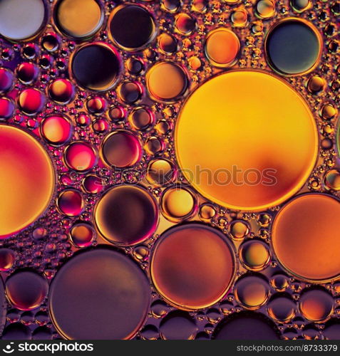 multicolored oil circles on the water, abstract background