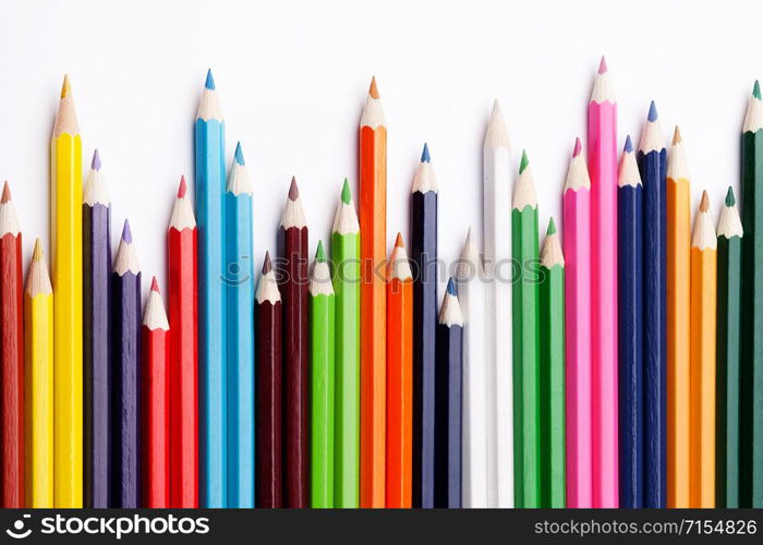 Multicolored pencils on a white background, the concept of business growth, learning. Creative ideas.. Multicolored pencils on a white background, the concept of business growth, learning.