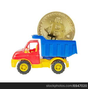 Multicolored plastic toy lorry delivers a symbolic coin of bitcoin crypto currency, new digital money in cyber world, isolated on white background