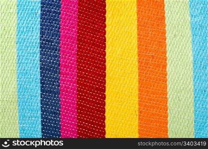 Multicolored striped background. Multicolored striped canvas background, woven texture