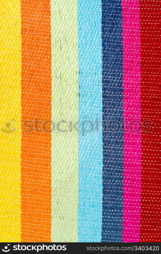 Multicolored striped background. Multicolored striped canvas background, woven texture