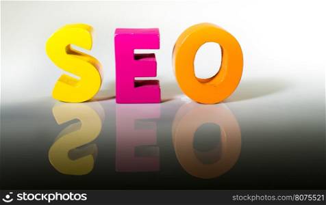 Multicolored text seo made of wood. White background