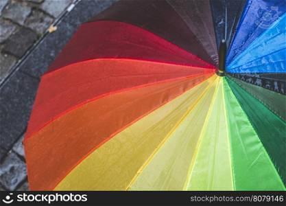 Multicolored umbrella in rainy day. Bulgaria, Plovdiv