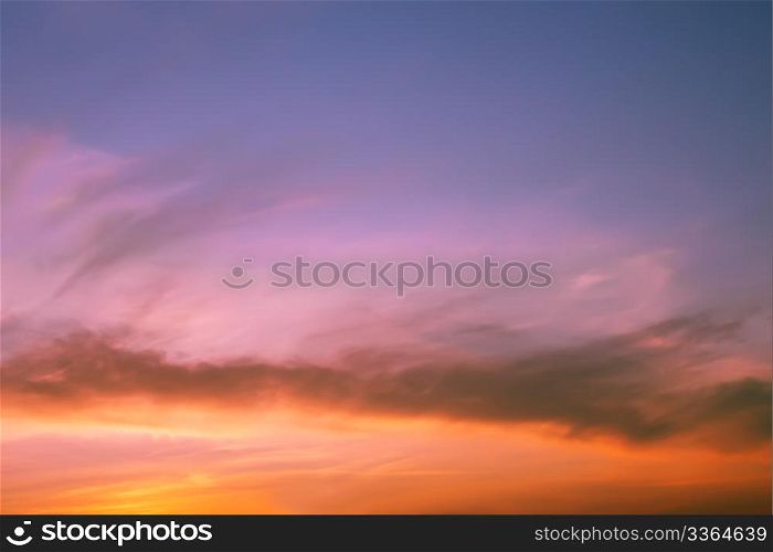 Multicolour clouds at sunset, fine summer evening