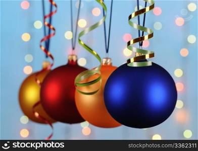 multicoloured christmas-tree decorations on blue background