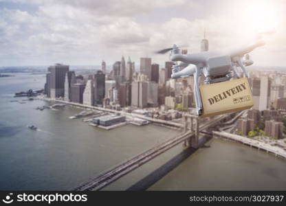 Multicopter flying over New York City. unmanned Multicopter drone flying with package over lower Manhatten, New York City