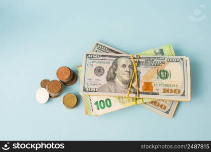Multicurrency banknotes, euro coins, dollars on a blue background. The concept of the world economy in times of crisis, top view. Multicurrency banknotes, euro coins, dollars on a blue background. The concept of the world economy in times of crisis, top view.