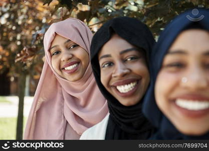 multiethnic business woman group portrait wearing traditional islamic clothes