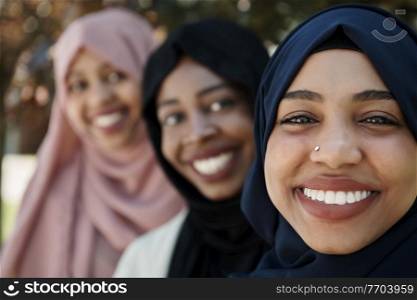 multiethnic business woman group portrait wearing traditional islamic clothes