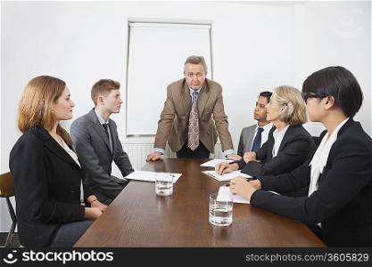 Multiethnic businesspeople at meeting in conference room