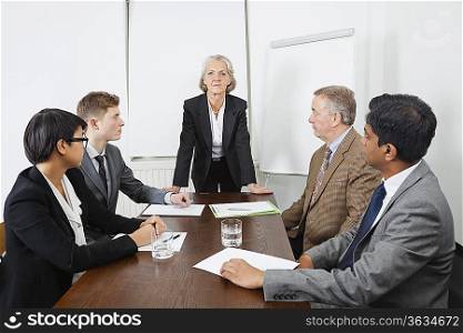 Multiethnic businesspeople at meeting in conference room