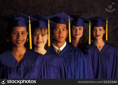 Multiethnic Graduates Standing Together And Smiling