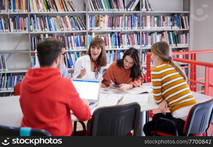 Multiethnic startup business team Arabian woman wearing a hijab on meeting in modern open plan office interior brainstorming, working on laptop and desktop computer