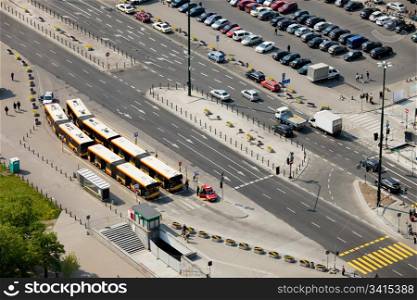 Multilane street, bus depot and parking lot in Warsaw, Poland, view from above