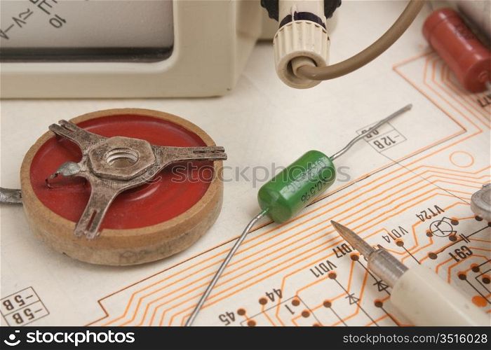 multimeter and electronic components on circuit