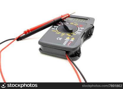 Multimeter of black color with a red and black wire on a white background