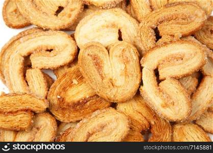 multiple layered shortbread cookies on white isolated background