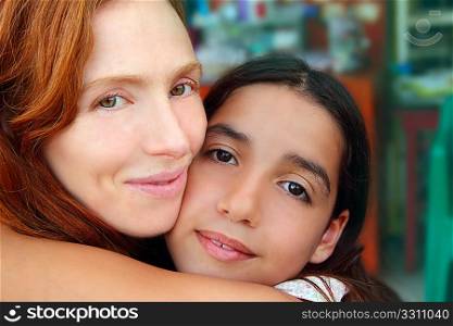 multiracial american mother and daughter family hug