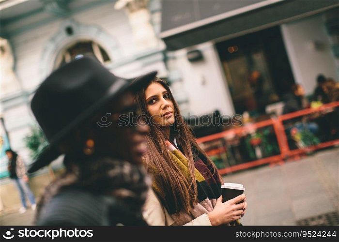 Multiracial modern women walking in the town