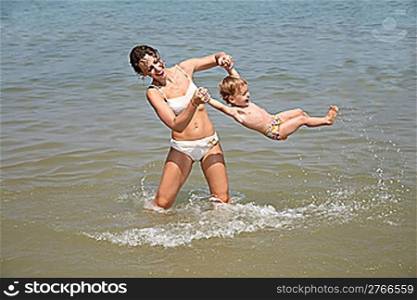 Mum and daughter have a good time in the sea