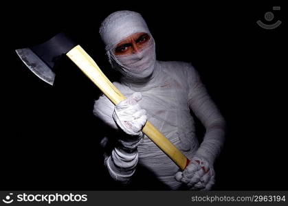 Mummy with axe in halloween concept