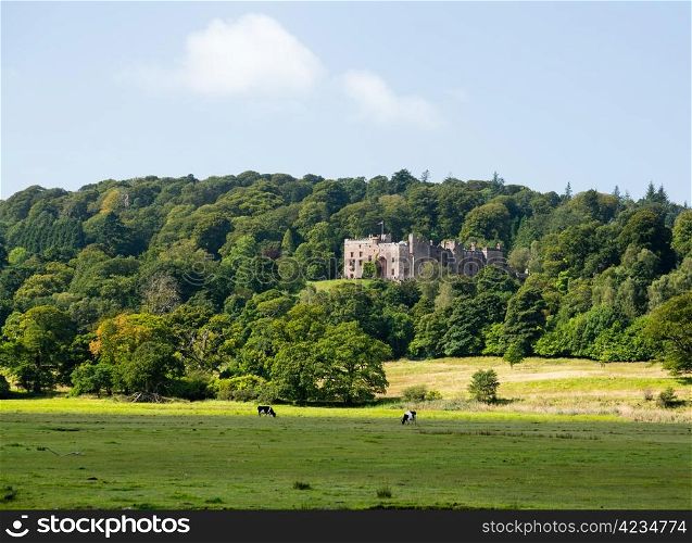 Muncaster Castle nestles in woodland on the edge of Lake District in England