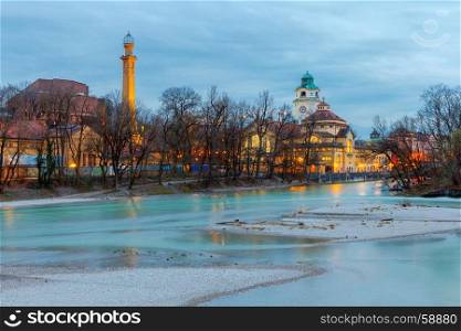 Munich. Embankment of the Isar.. View of the city embankment and the river Isar at sunset. Munich. Germany. Bavaria.