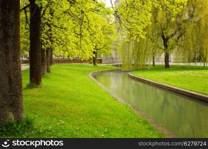 Munich&rsquo;s park with river at spring