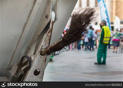 Municipal Dustman Worker with Cleaning Tools in Public Streets