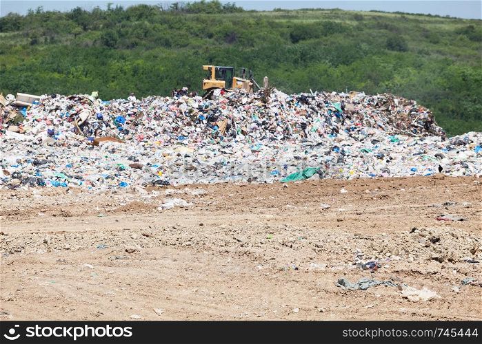 Municipal garbage dump at landfill. Environmental pollution.