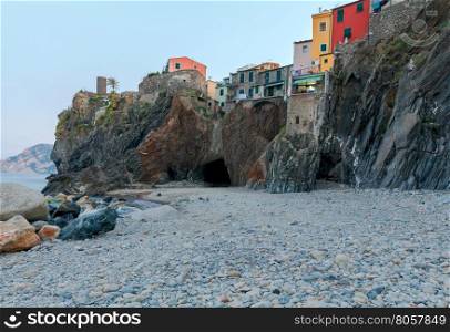 Municipal pebble beach in the old village of Vernazza. Parco Nazionale delle Cinque Terre, Liguria, Italy.