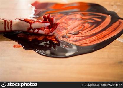 murder, kill and people concept - dead woman hand in blood on floor at crime scene. dead woman hand in blood on floor at crime scene