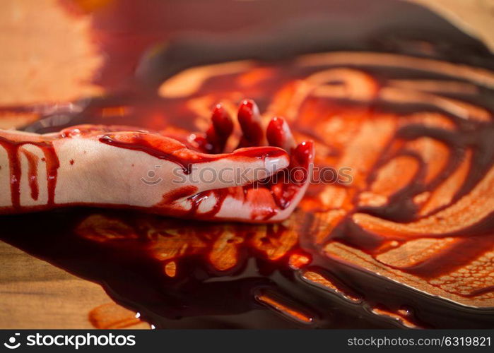 murder, kill and people concept - dead woman hand in blood on floor at crime scene. dead woman hand in blood on floor at crime scene