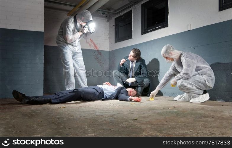 Murder scene with two forensic analysts and a police lieutenant investigating a crime on a businessman in a basement