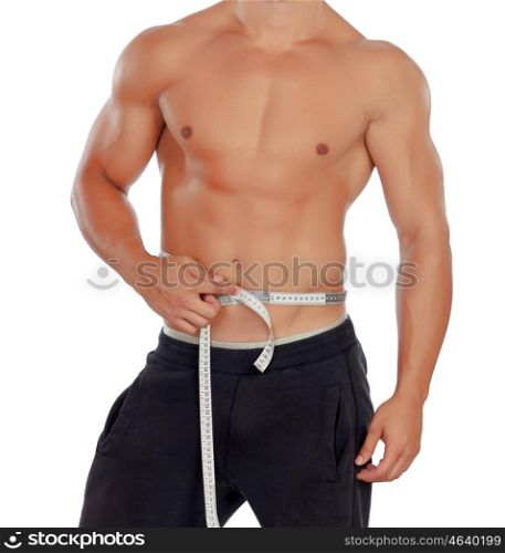 Muscled man with tape measure isolated on a white background